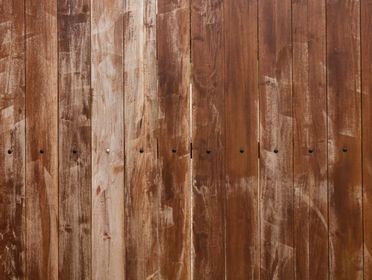 A close-up view of a rustic wooden fence panel showcasing natural textures in Medellín, Colombia.