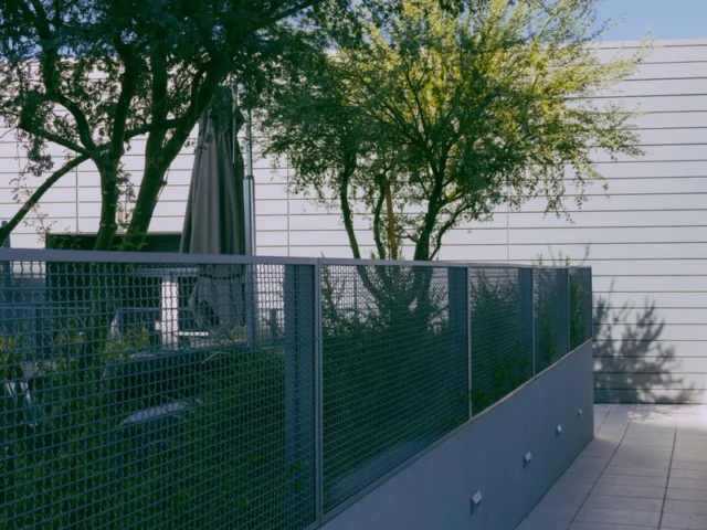 Welded mesh fence around a commercial building