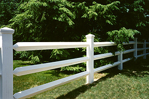 White vinyl post and rail fence