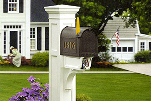 White mailbox post with black mailbox