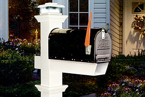 White mailbox post with black mailbox